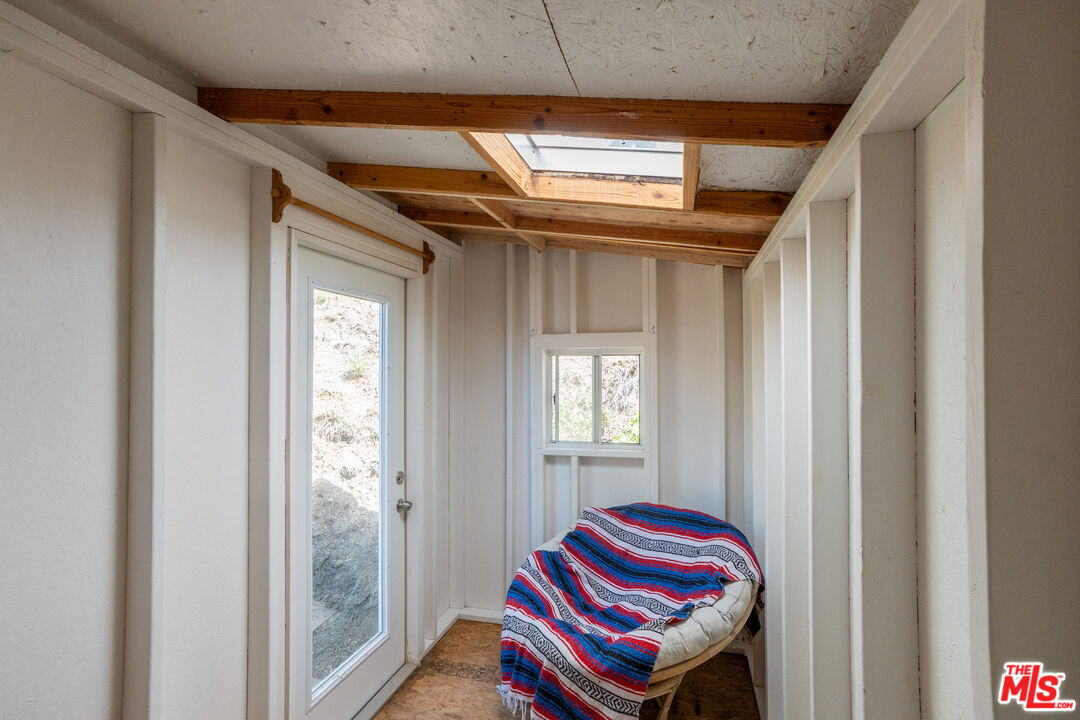 1183 Aztec Topanga, CA 90290 - Photo 37 of 68 a room with a bed and a window