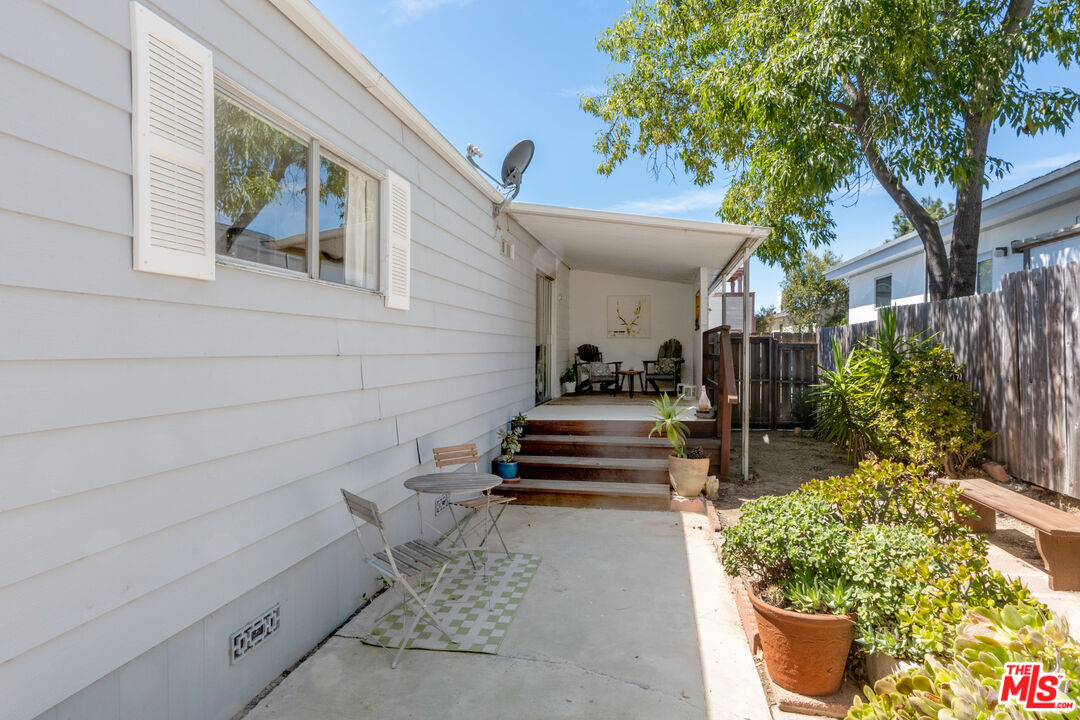 1183 Aztec Topanga, CA 90290 - Photo 40 of 68 a view of a patio with table and chairs and potted plants