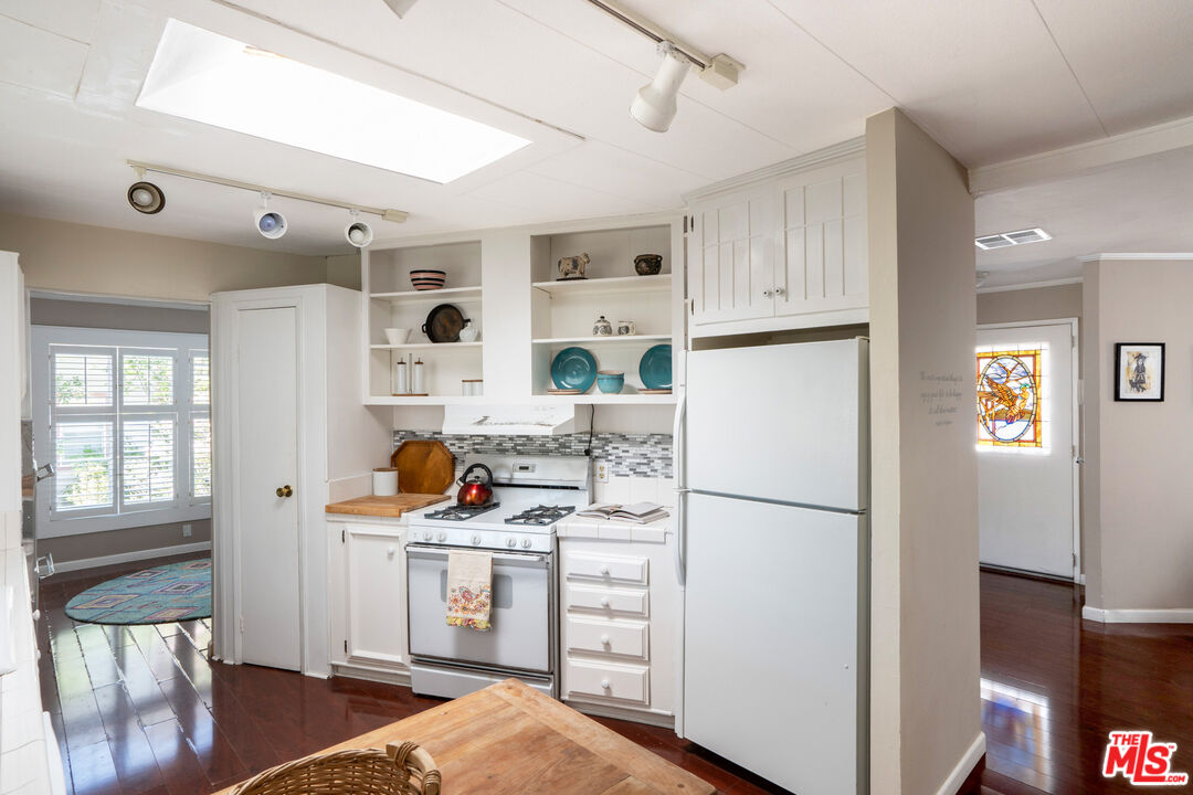 1183 Aztec Topanga, CA 90290 - Photo 4 of 68 a kitchen with stainless steel appliances granite countertop a refrigerator and a stove