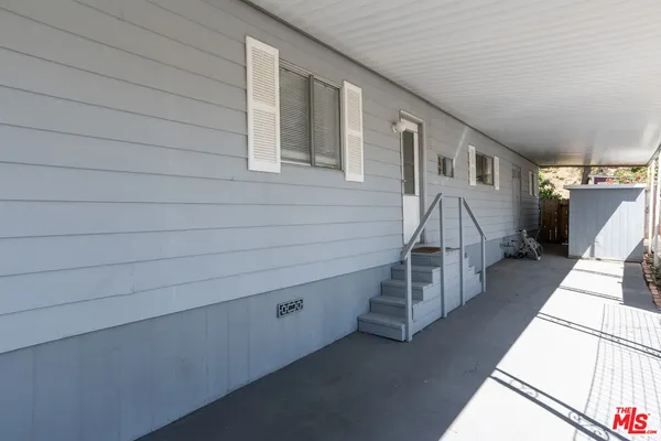 a kitchen with granite countertop a stove and a sink