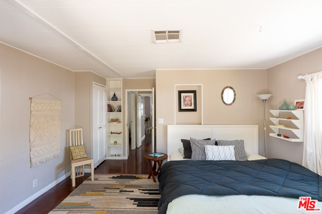 1183 Aztec Topanga, CA 90290 - Photo 47 of 68 a bedroom with a large bed and a window