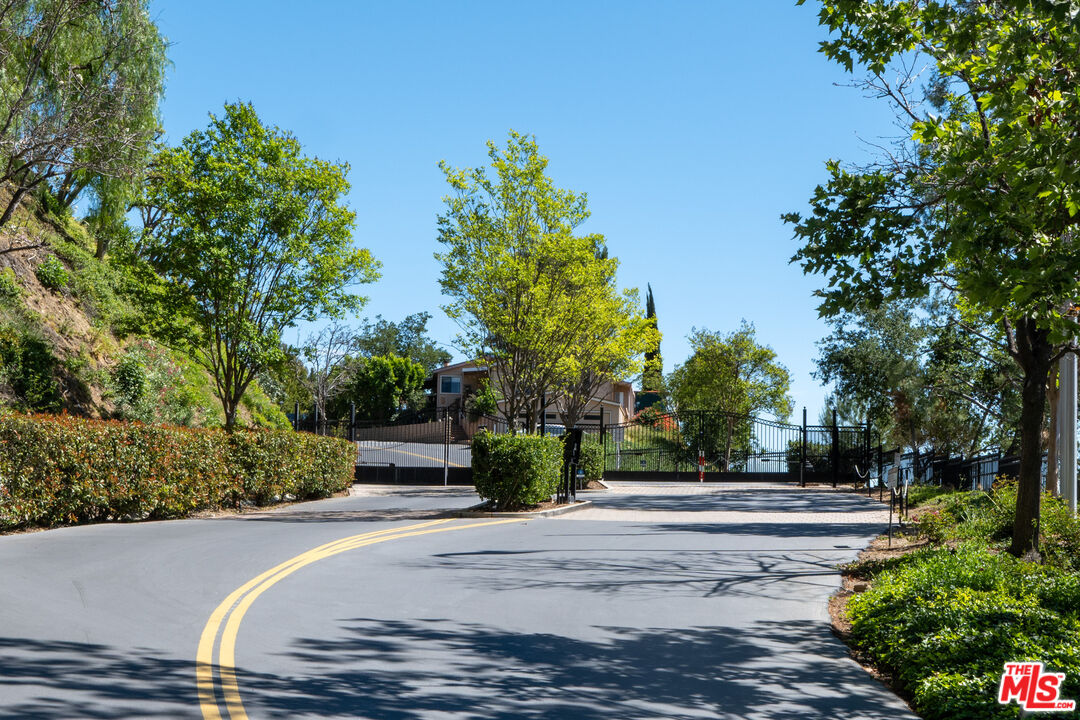 1183 Aztec Topanga, CA 90290 - Photo 52 of 68 a front view of a house with a yard