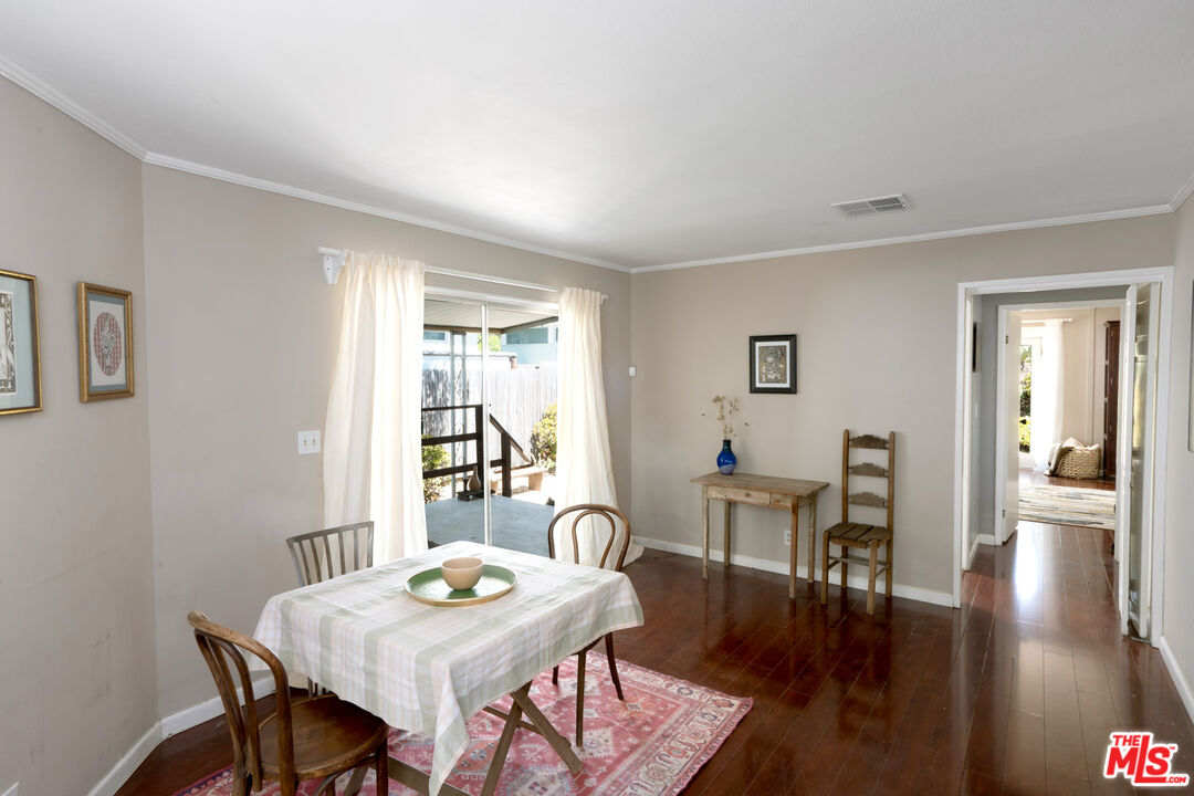 1183 Aztec Topanga, CA 90290 - Photo 6 of 68 a view of a dining room with furniture and wooden floor