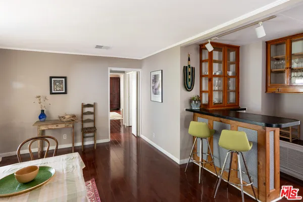 a swimming pool with an outdoor space and seating area