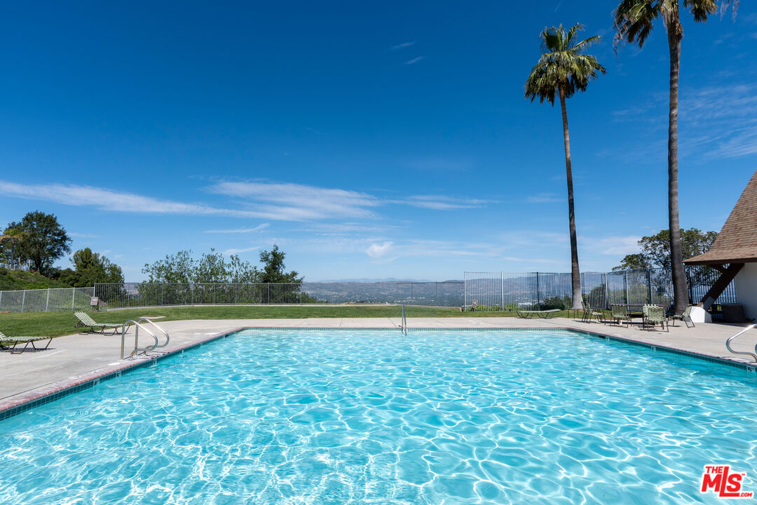 1183 Aztec Topanga, CA 90290 - Photo 10 of 68 a swimming pool with an outdoor space and seating area