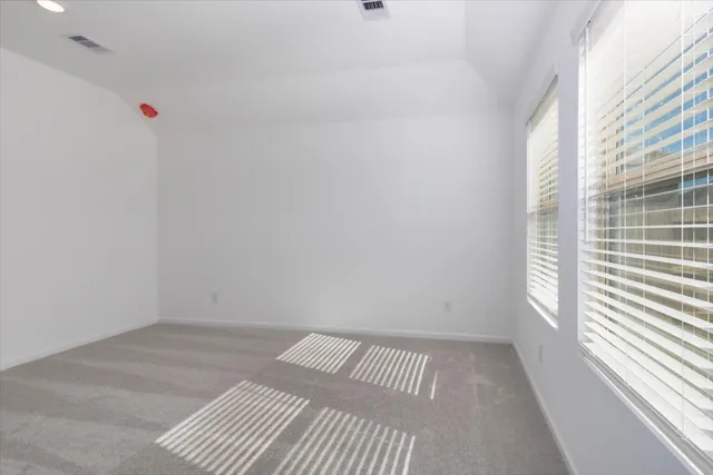 a view of a room with tiles and a window