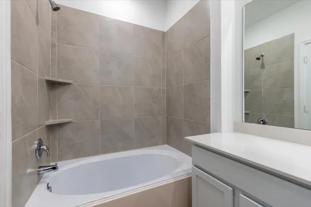 a bathroom with a bathtub and a shower