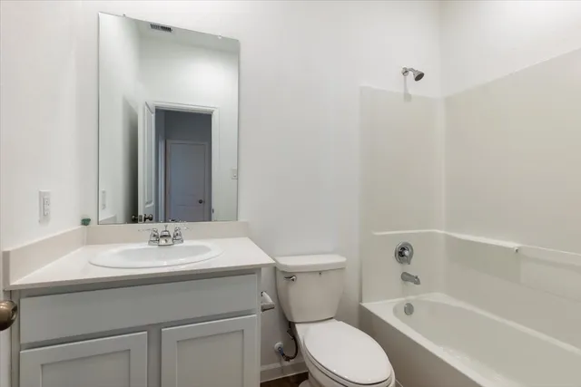a bathroom with a sink toilet and bathtub