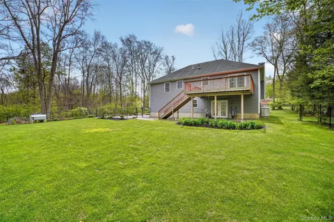 a view of a house with a big yard