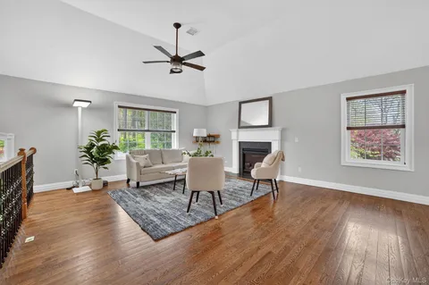 a living room with furniture rug and window