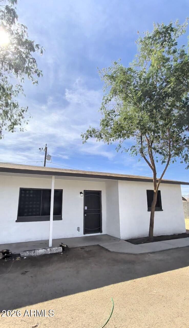 9602 North 18th Avenue Phoenix, AZ 85021 - Photo 9 of 18 a front view of a house with a yard