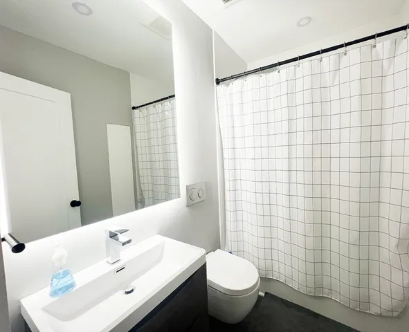 a bathroom with a sink and toilet