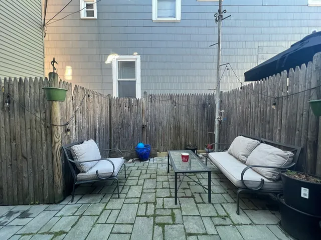 a backyard of a house with seating space