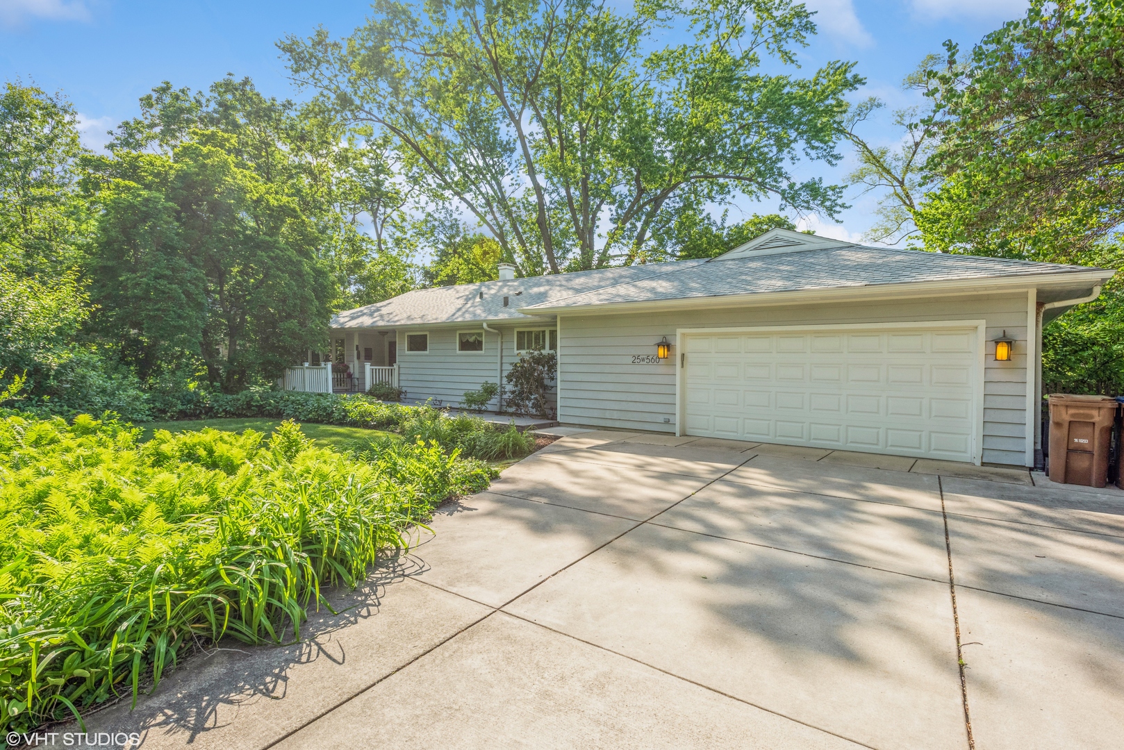 25W560 Piccadilly Road Wheaton, IL 60189 - Photo 1 of 33 a front view of a house with garden