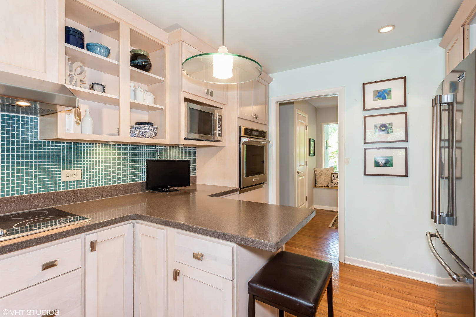 25W560 Piccadilly Road Wheaton, IL 60189 - Photo 13 of 33 a kitchen with cabinets and wooden floor
