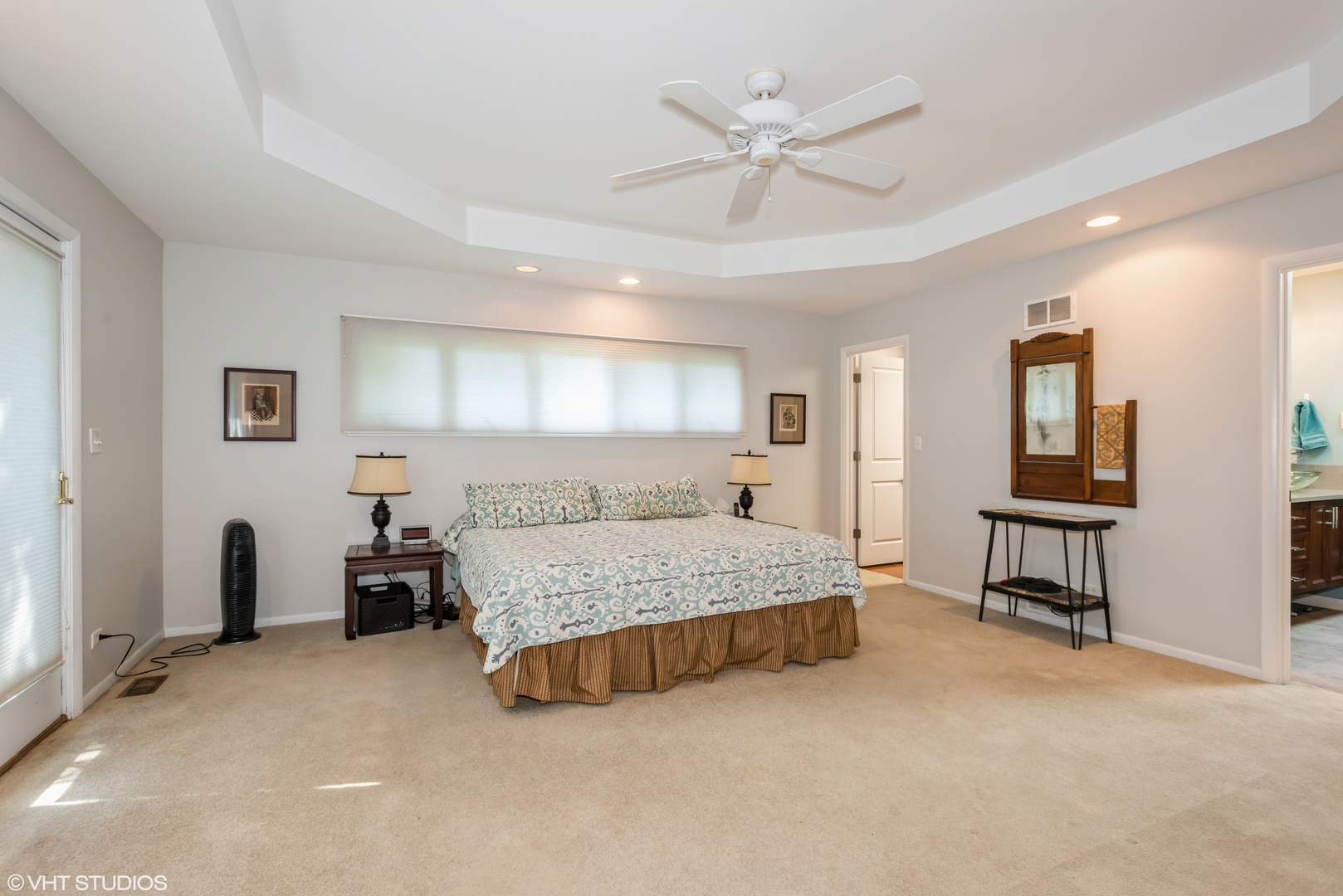 25W560 Piccadilly Road Wheaton, IL 60189 - Photo 18 of 33 a spacious bedroom with a bed and a chandelier
