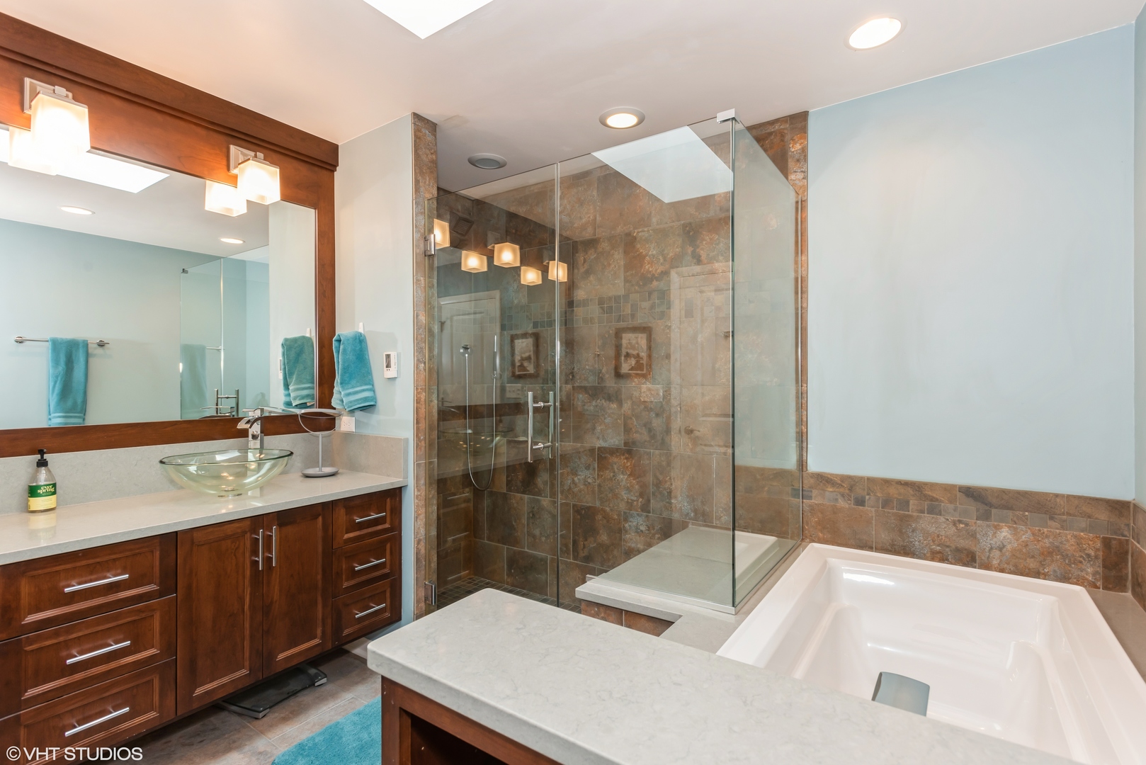 25W560 Piccadilly Road Wheaton, IL 60189 - Photo 20 of 33 a bathroom with a sink and mirror with shower