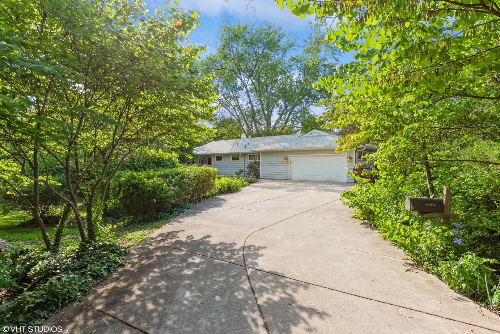 25W560 Piccadilly Road Wheaton, IL 60189 - Photo 2 of 33 a front view of a house with a garden