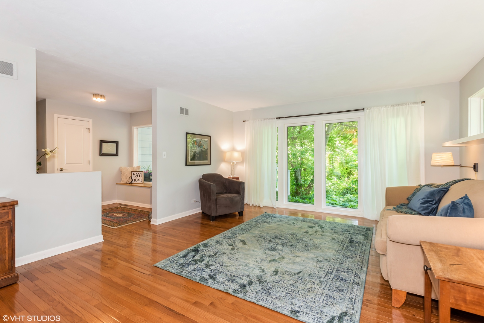 25W560 Piccadilly Road Wheaton, IL 60189 - Photo 9 of 33 a living room with furniture and a rug