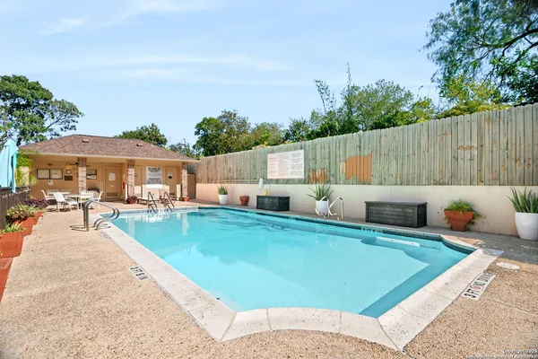 an outdoor space with furniture and umbrella