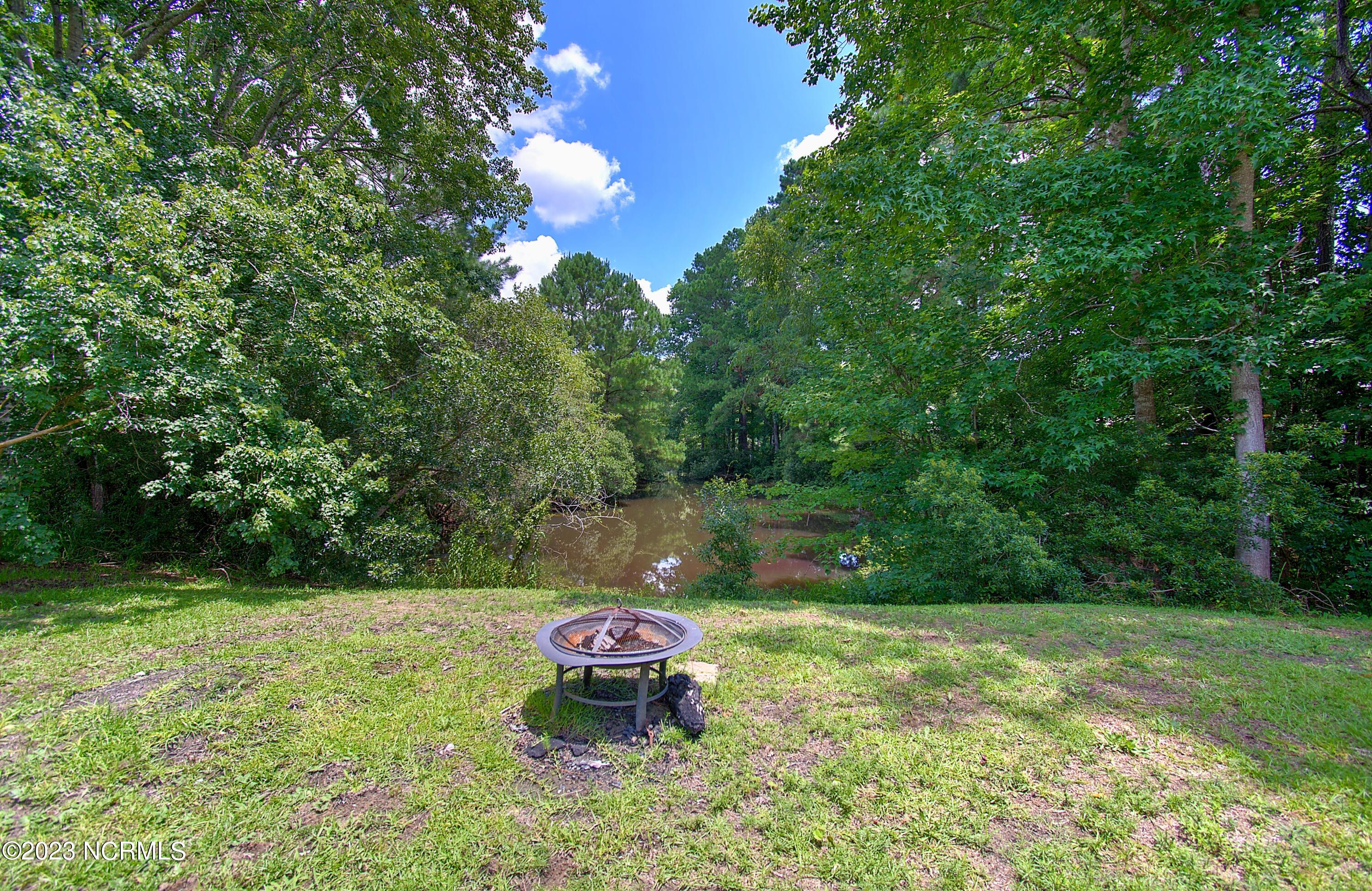 1214 Stone Chimney Road Southwest Supply, NC 28462 - Photo 17 of 22 Firepit in the backyard