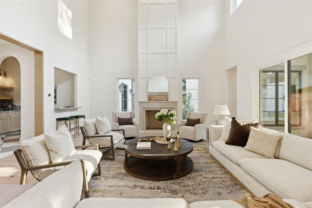 11815 Jamestown Road Dallas, TX 75230 - Photo 12 of 39 a living room with fireplace furniture and a potted plant