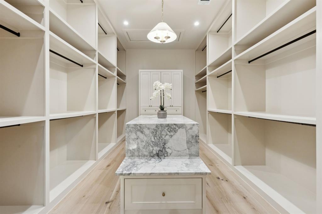 11815 Jamestown Road Dallas, TX 75230 - Photo 17 of 39 a view of a kitchen with cabinet and entryway