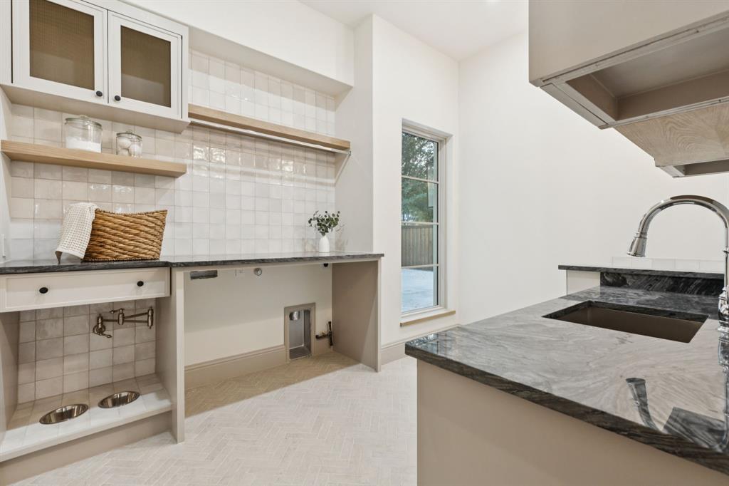 11815 Jamestown Road Dallas, TX 75230 - Photo 20 of 39 a kitchen with a sink and cabinets