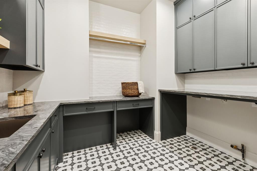11815 Jamestown Road Dallas, TX 75230 - Photo 26 of 39 a kitchen with a sink and cabinets