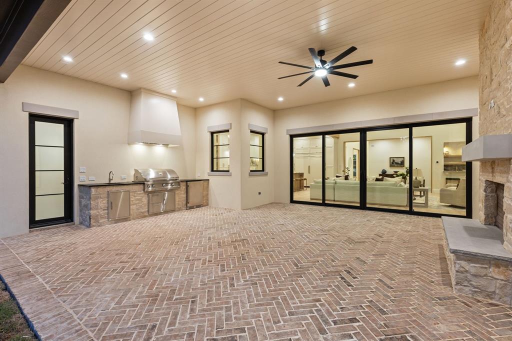 11815 Jamestown Road Dallas, TX 75230 - Photo 32 of 39 a view of an empty room with window and a ceiling fan
