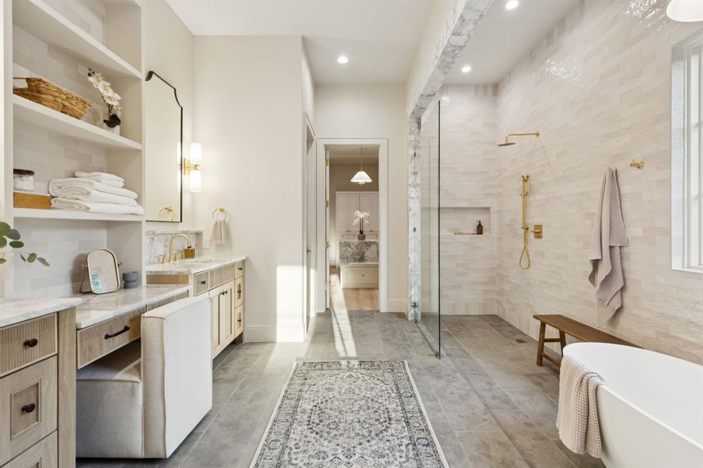 11815 Jamestown Road Dallas, TX 75230 - Photo 38 of 39 a spacious bathroom with a granite countertop sink mirror and shower
