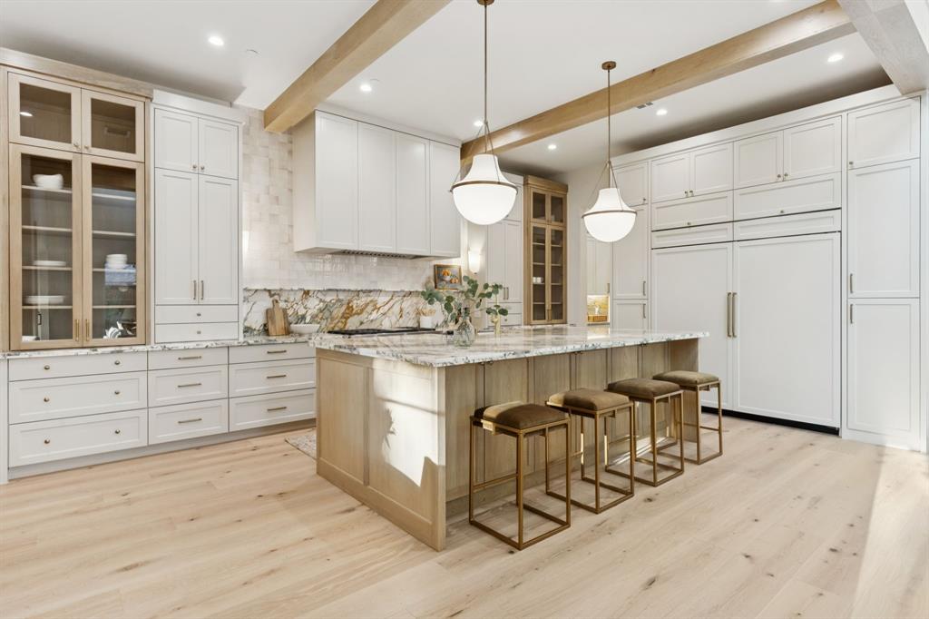 11815 Jamestown Road Dallas, TX 75230 - Photo 9 of 39 a kitchen with granite countertop a sink cabinets stainless steel appliances and a window