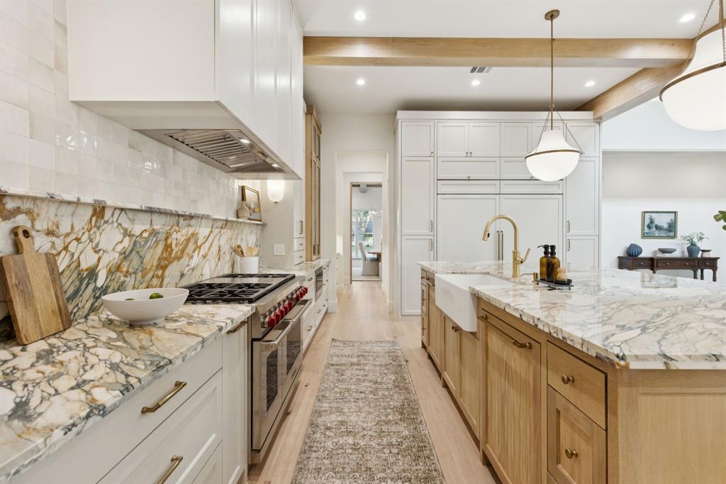 11815 Jamestown Road Dallas, TX 75230 - Photo 10 of 39 a kitchen with stainless steel appliances granite countertop a sink and stove