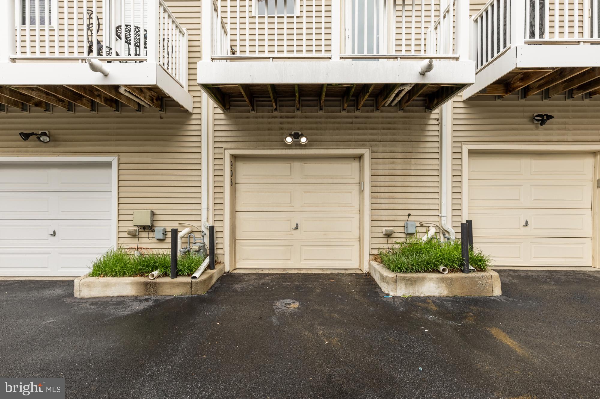 906 3rd Street Southeast Washington, DC 20003 - Photo 14 of 14 a front view of a house with a yard and garage