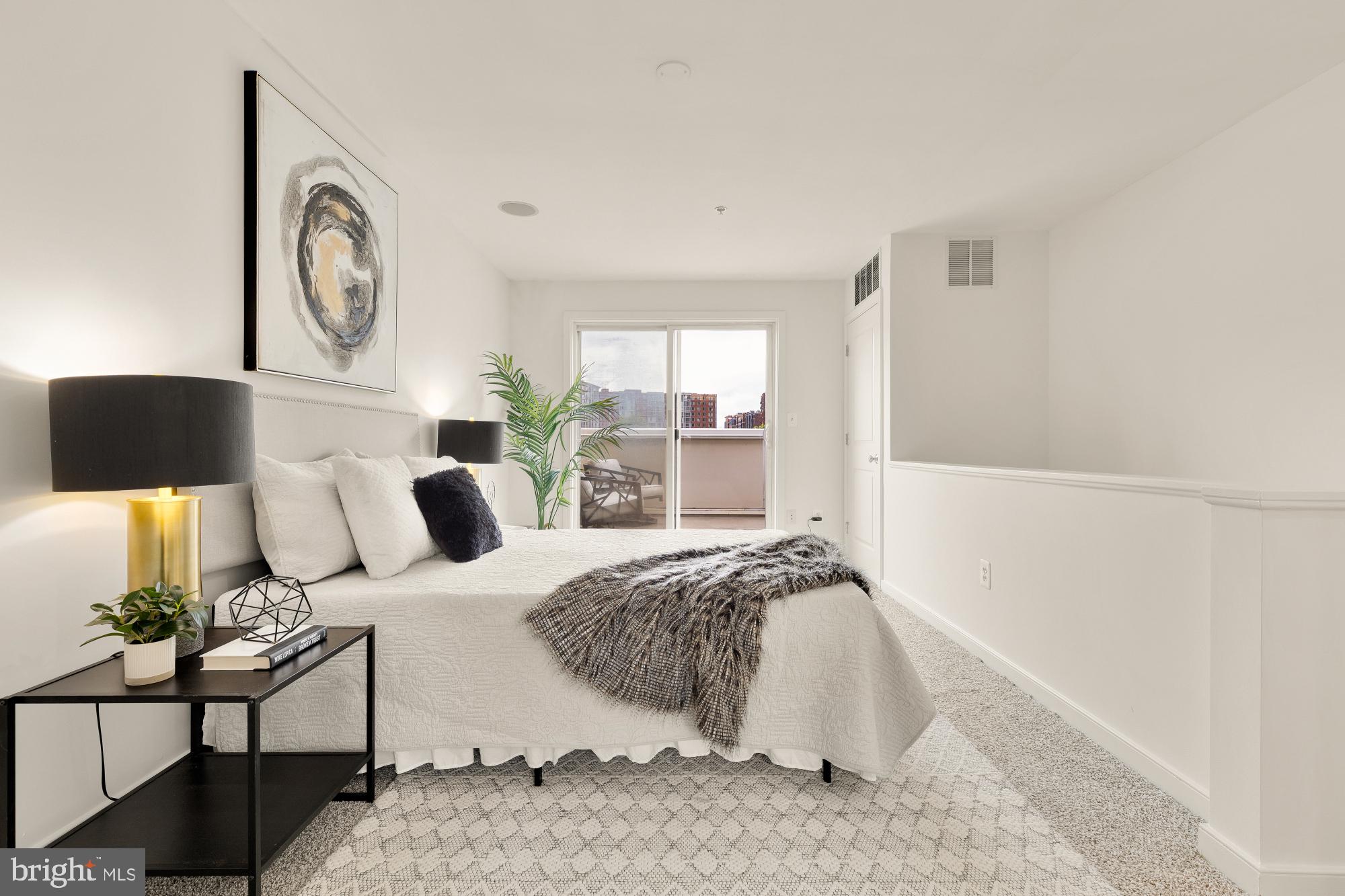 906 3rd Street Southeast Washington, DC 20003 - Photo 6 of 14 a bedroom with a bed and window