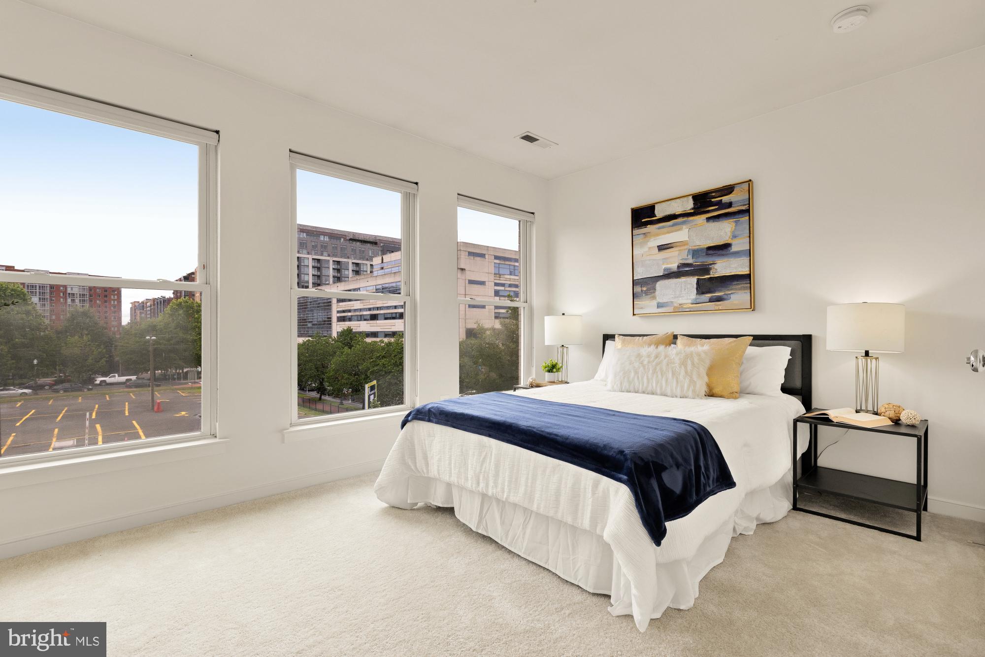 906 3rd Street Southeast Washington, DC 20003 - Photo 9 of 14 a spacious bedroom with a large bed and a large window