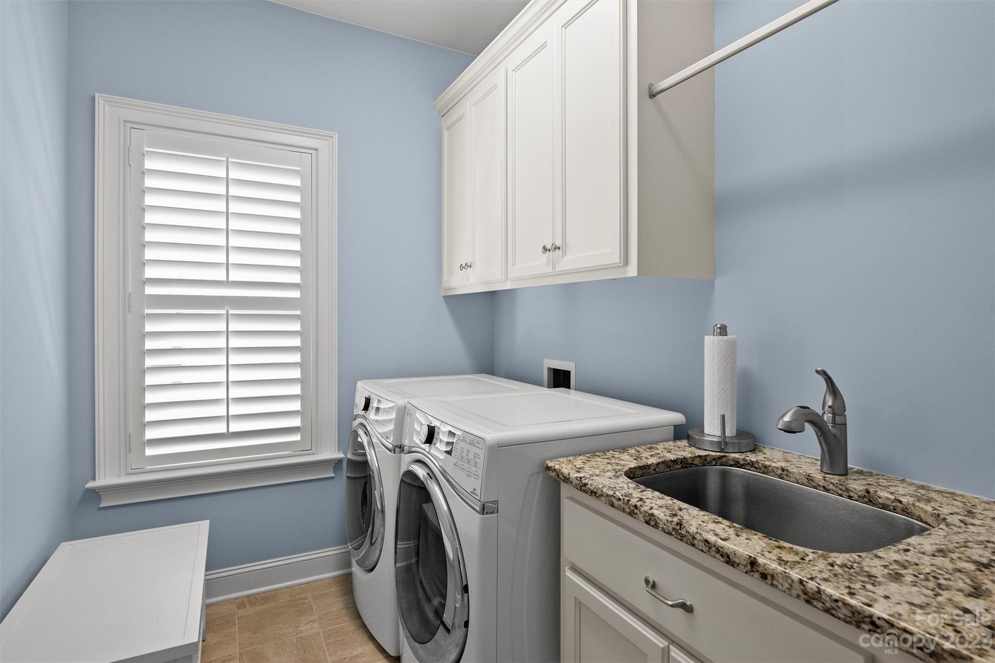 111 Boyce Road Charlotte, NC 28211 - Photo 20 of 38 a utility room with dryer and washer