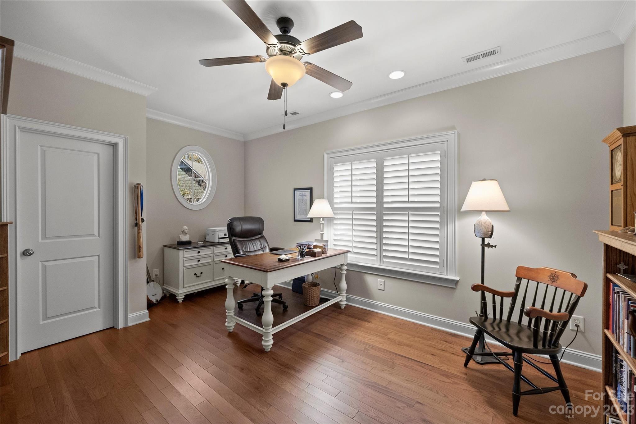 111 Boyce Road Charlotte, NC 28211 - Photo 24 of 38 a workspace with wooden floor and a window