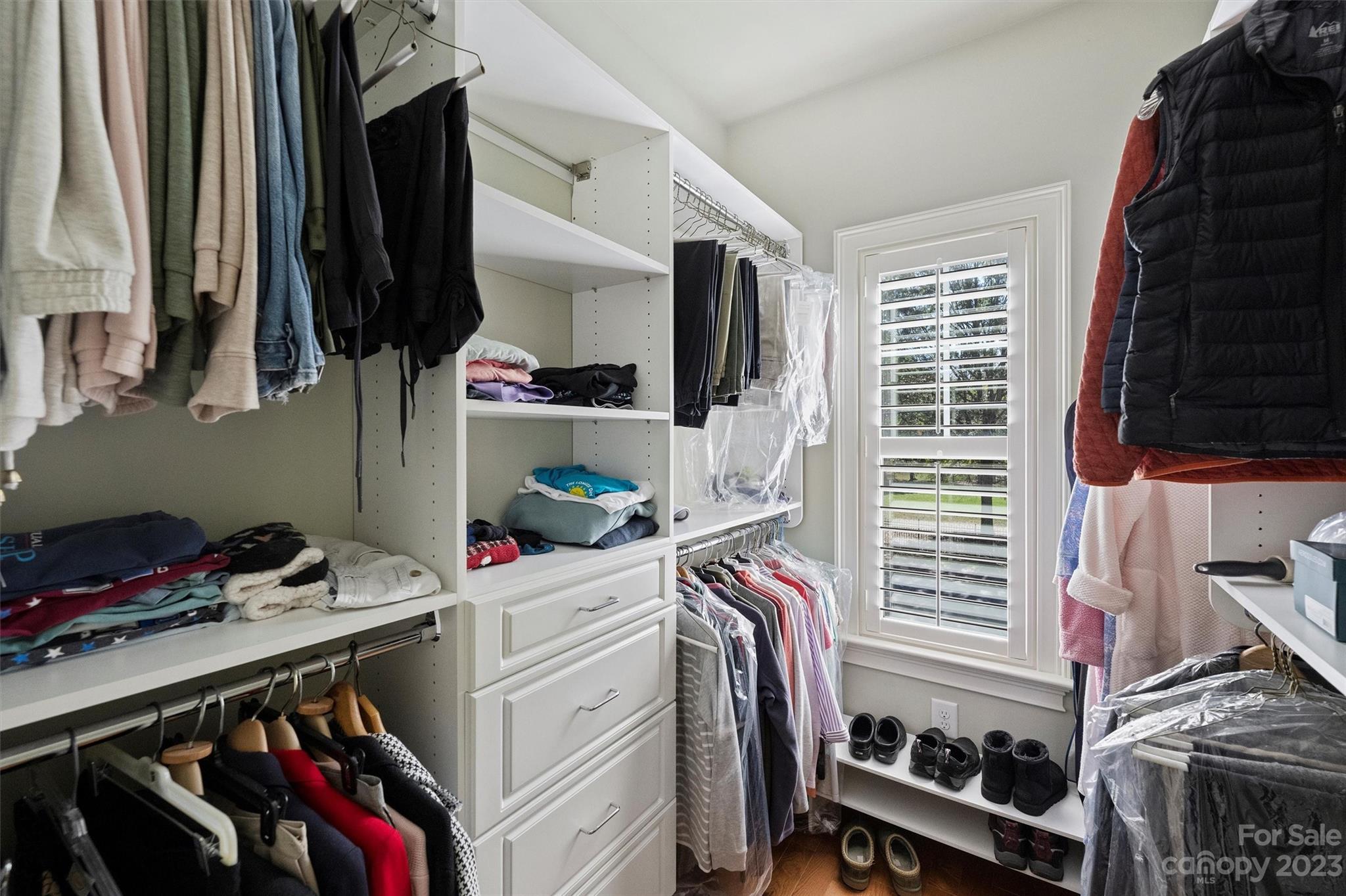 111 Boyce Road Charlotte, NC 28211 - Photo 26 of 38 a view of walk in closet with clothes and shoes