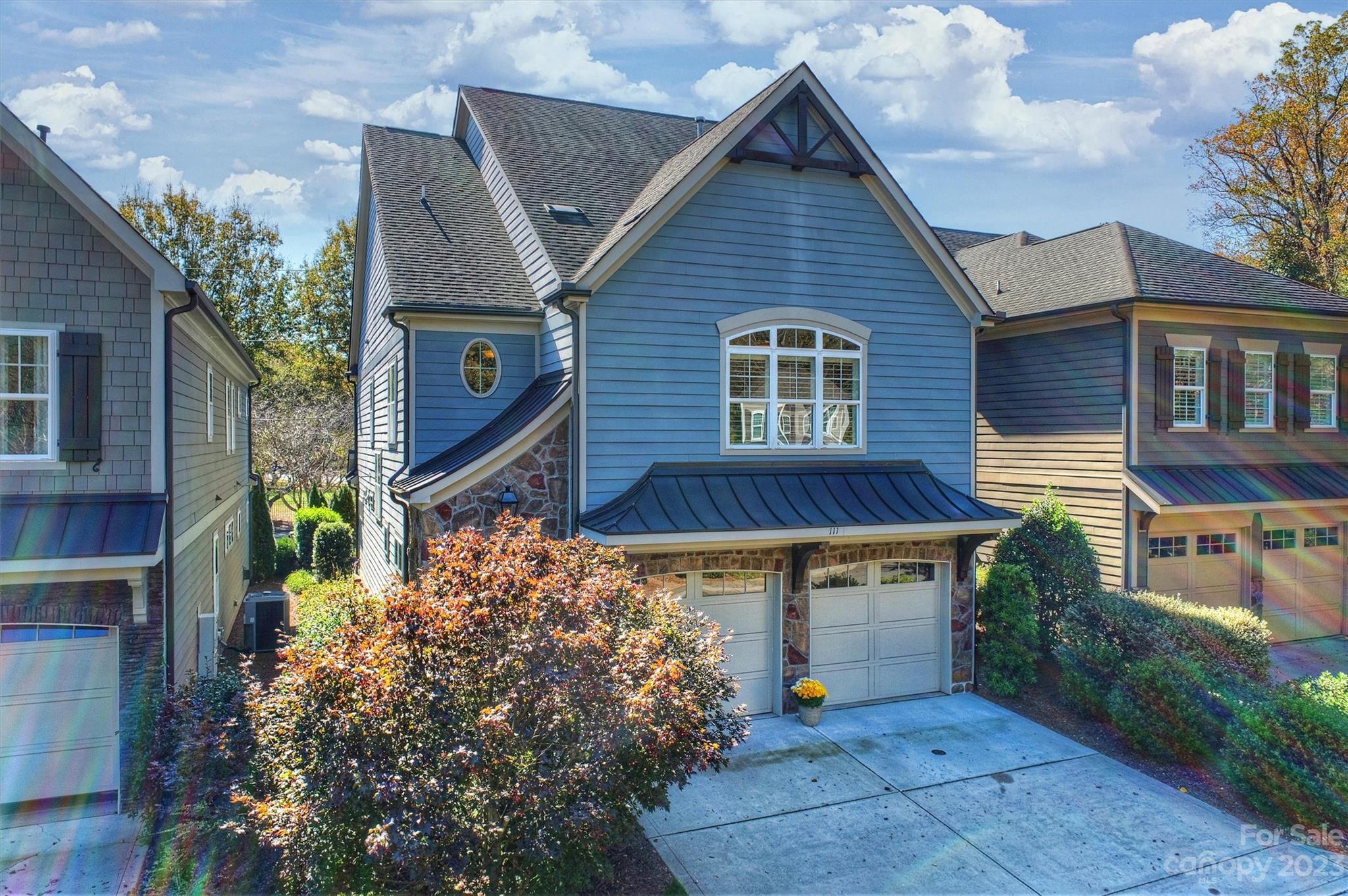 111 Boyce Road Charlotte, NC 28211 - Photo 3 of 38 a front view of a house with garden
