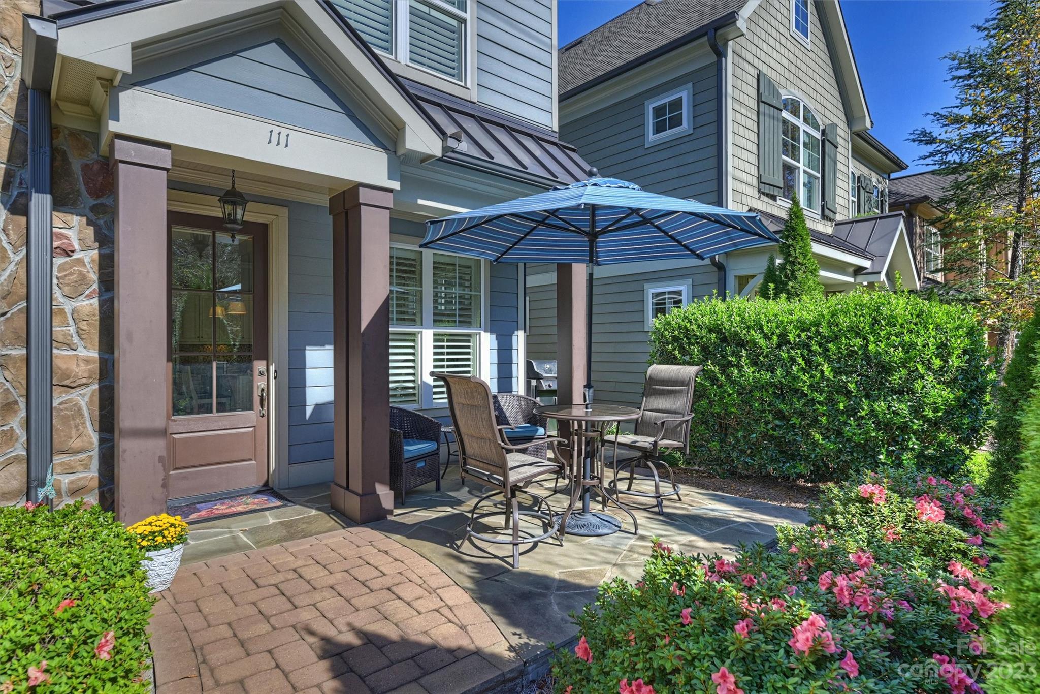 111 Boyce Road Charlotte, NC 28211 - Photo 31 of 38 a view of a patio with table and chairs and potted plants