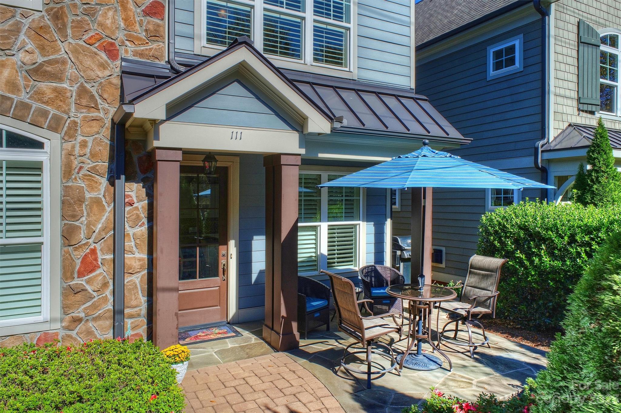 111 Boyce Road Charlotte, NC 28211 - Photo 33 of 38 front view of a house with a patio