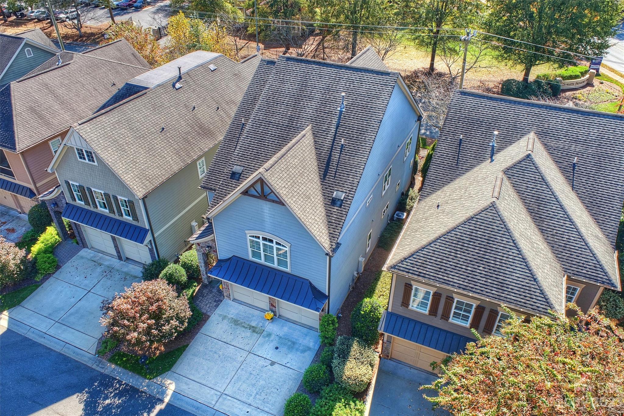 111 Boyce Road Charlotte, NC 28211 - Photo 6 of 38 a house with trees in front of it