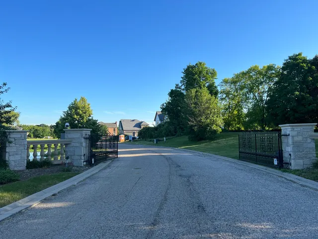 a view of a street with a yard