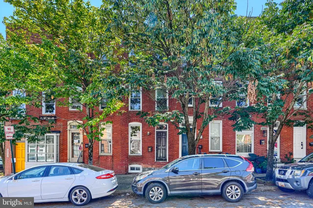 a car parked in front of a house