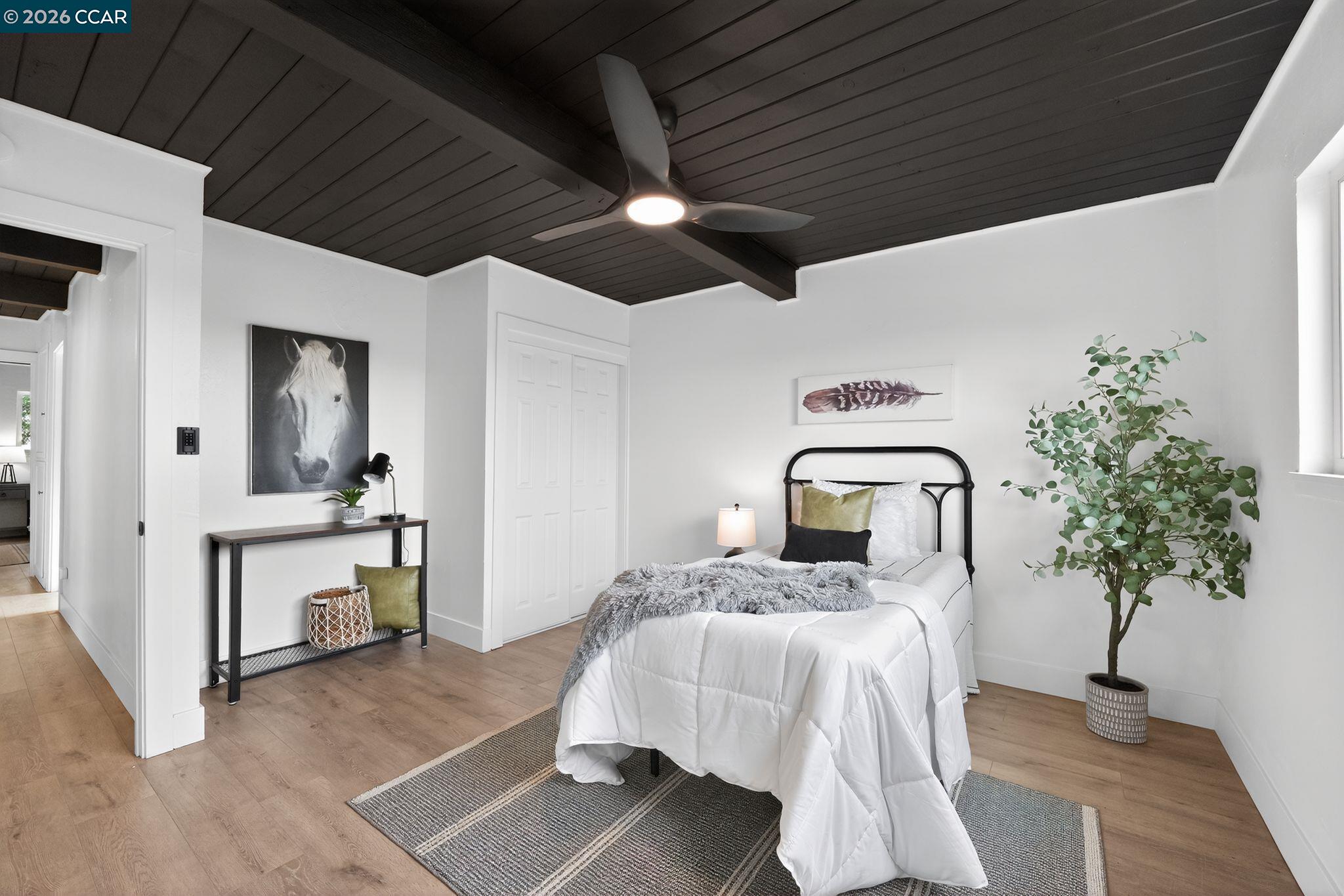 1838 Overhill Road Concord, CA 94520 - Photo 14 of 25 a bedroom with a bed and a potted plant