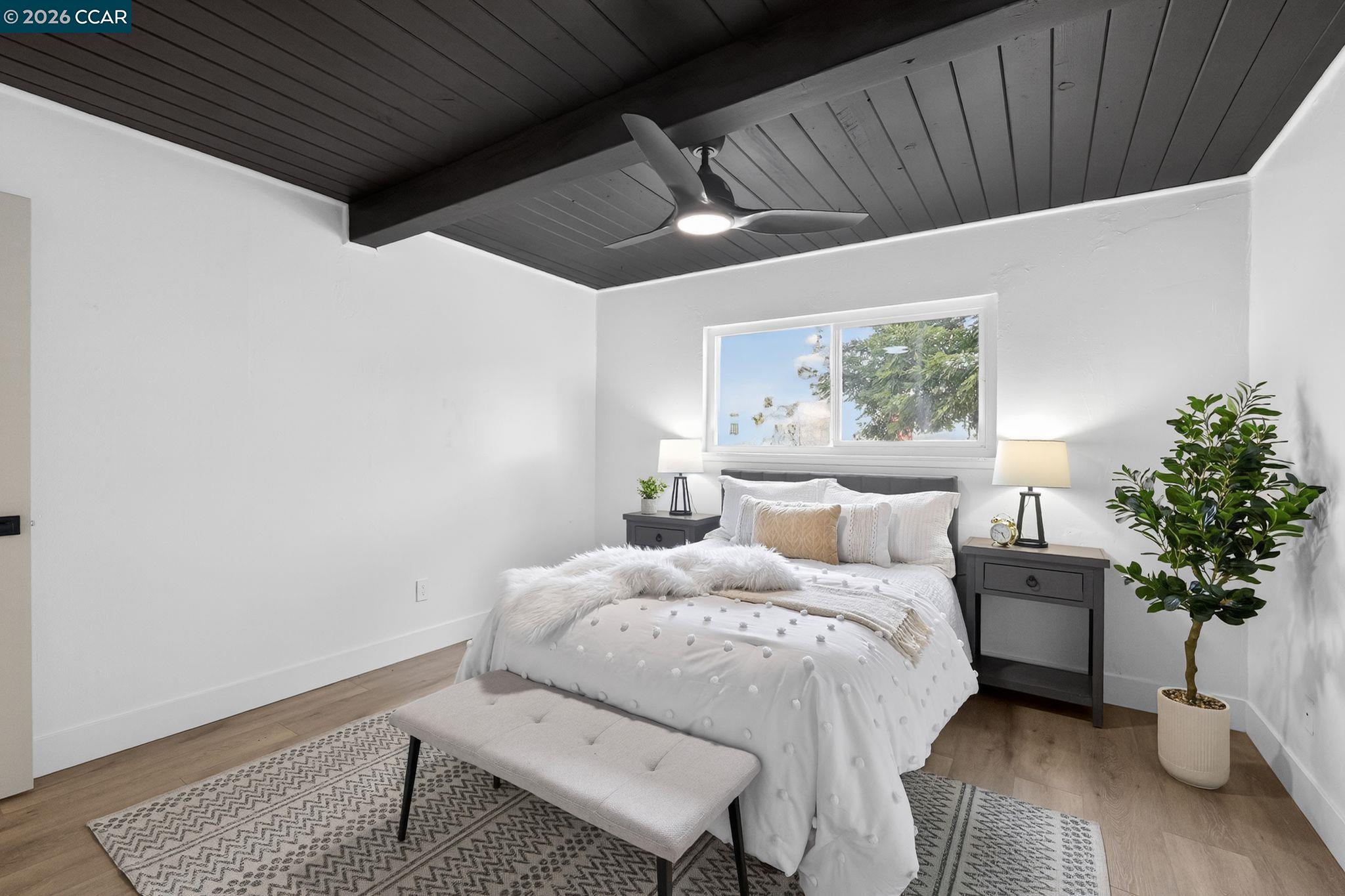 1838 Overhill Road Concord, CA 94520 - Photo 20 of 25 a bed room with a bed and a potted plant