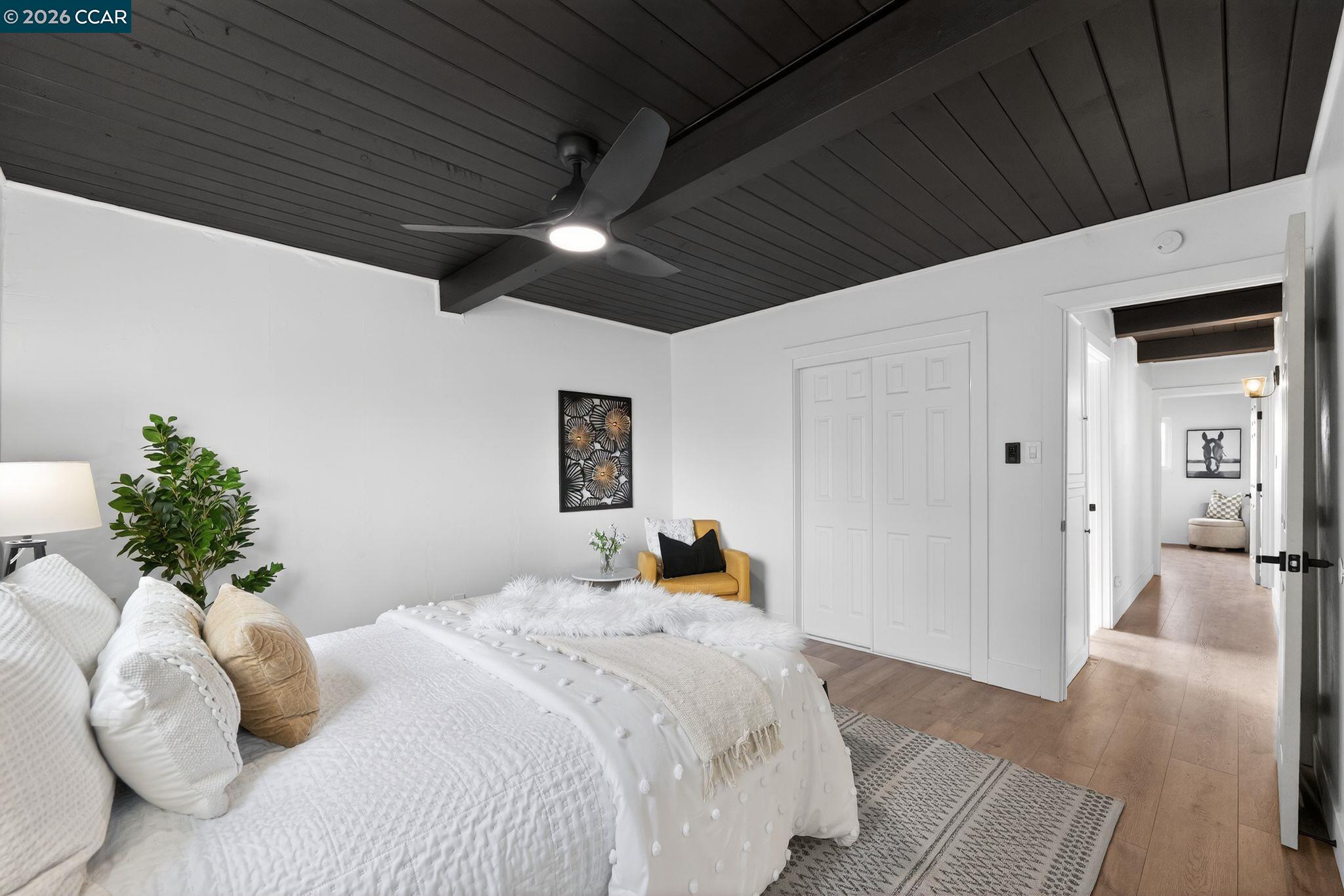 1838 Overhill Road Concord, CA 94520 - Photo 21 of 25 a bedroom with a bed and a chandelier