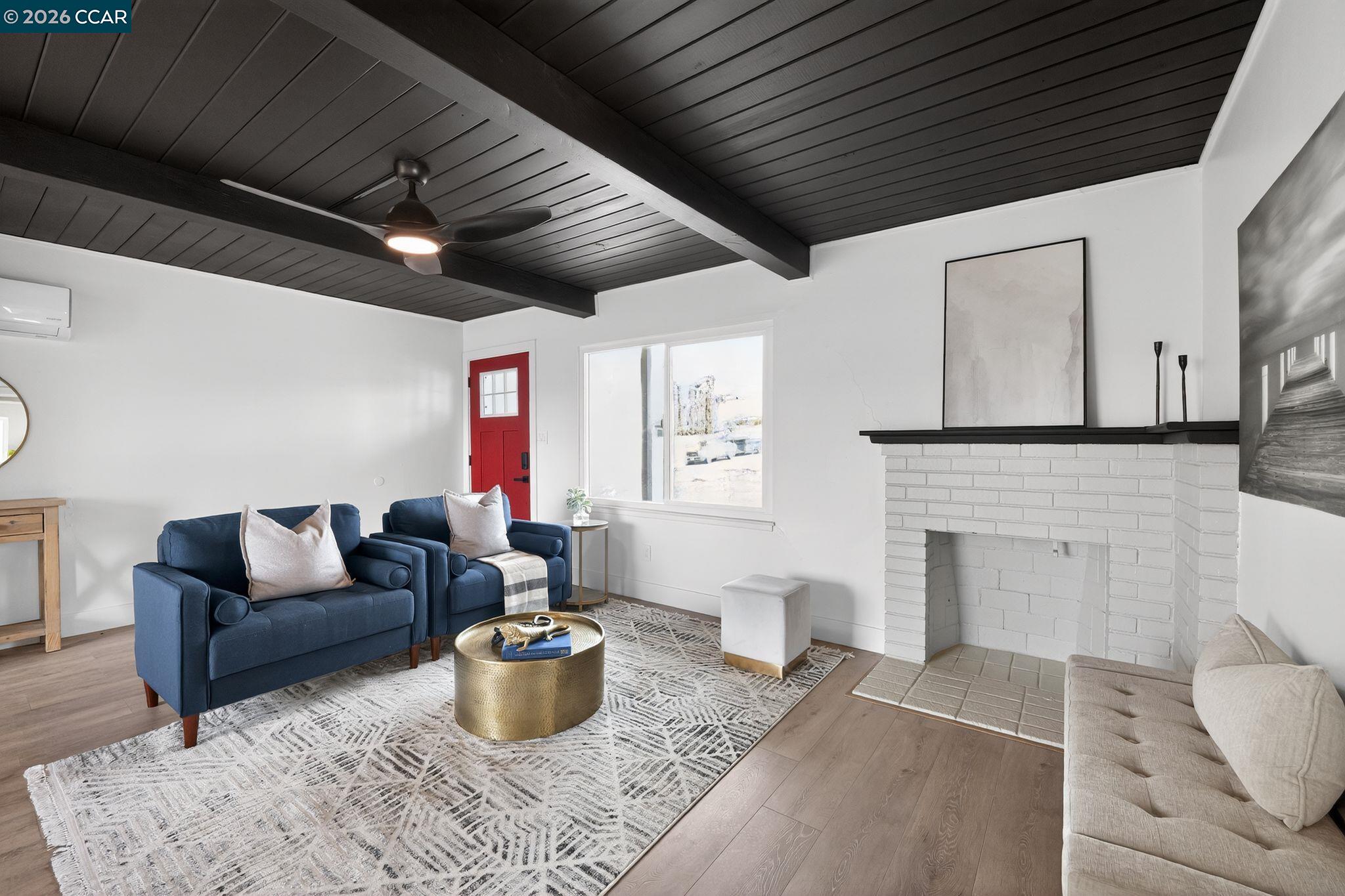 1838 Overhill Road Concord, CA 94520 - Photo 4 of 25 a living room with furniture a fireplace and a table