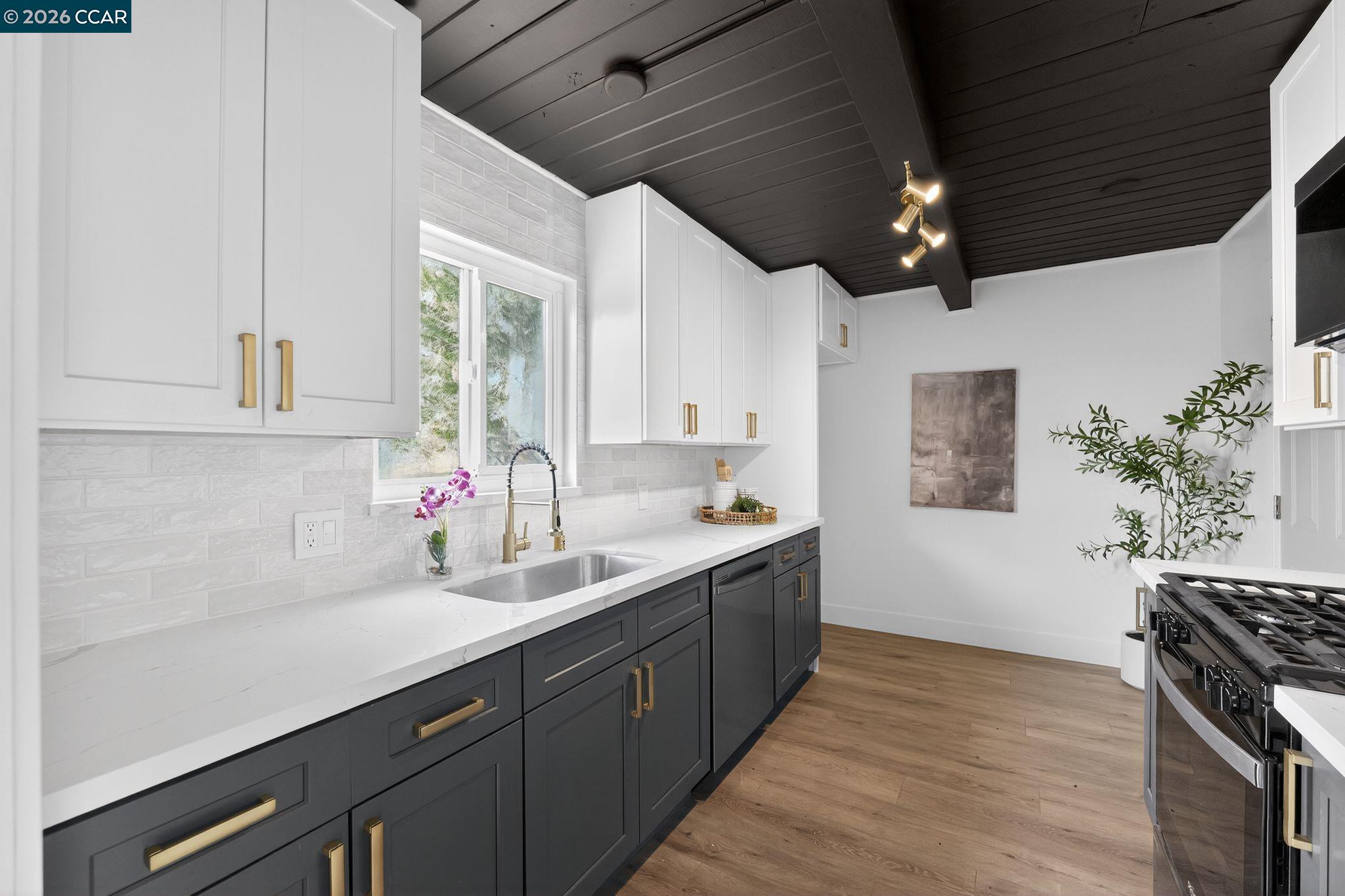 1838 Overhill Road Concord, CA 94520 - Photo 6 of 25 a kitchen with a sink stove and cabinets